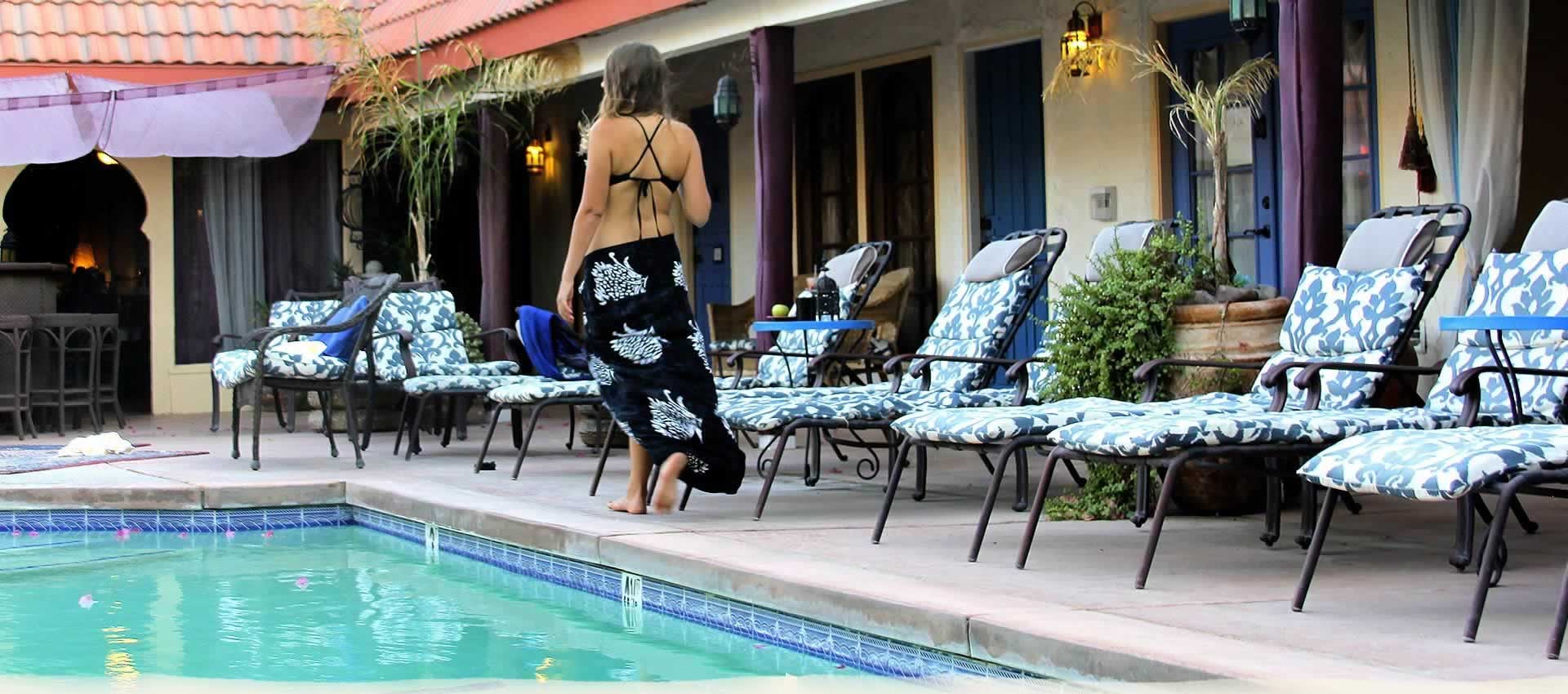 El Morocco Inn & Spa guest relaxing by the pool